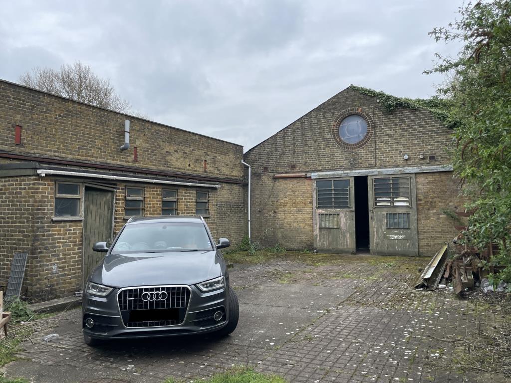 Lot: 48 - VALUABLE WORKSHOPS WITH OFFICES AND YARD AREA CLOSE TO TOWN CENTRE - View of courtyard and rear workshop